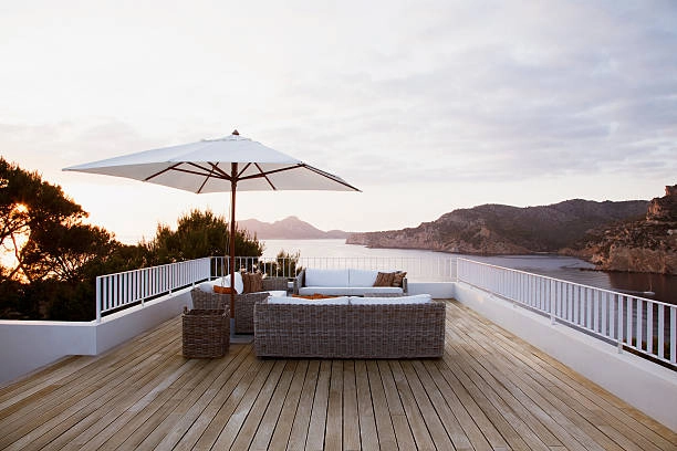 Modern coastal view with minimalist backyard deck and patio designs.